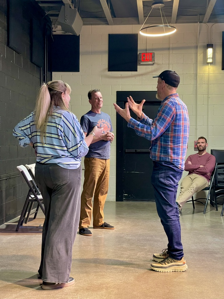 Matt Walsh coaching Robb and Annie in a scene