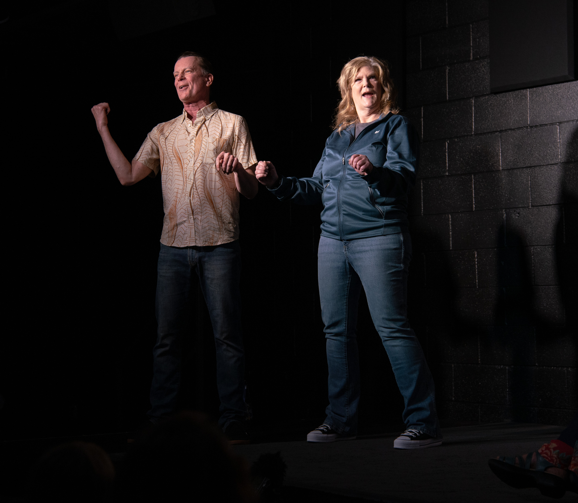 Ally and Robb in a high-energy two-person scene on stage